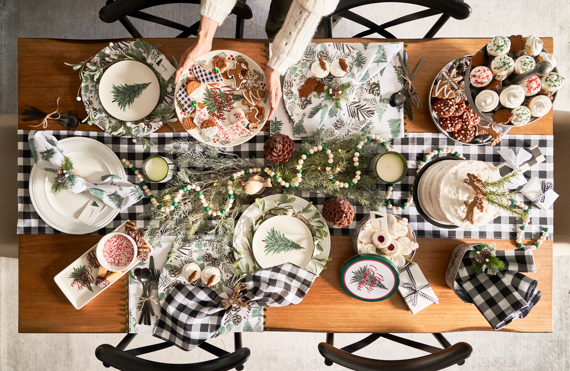 festive table spread of gingerbread holiday cake iced cookies candy alyssa wernick food stylist styling dallas tx
