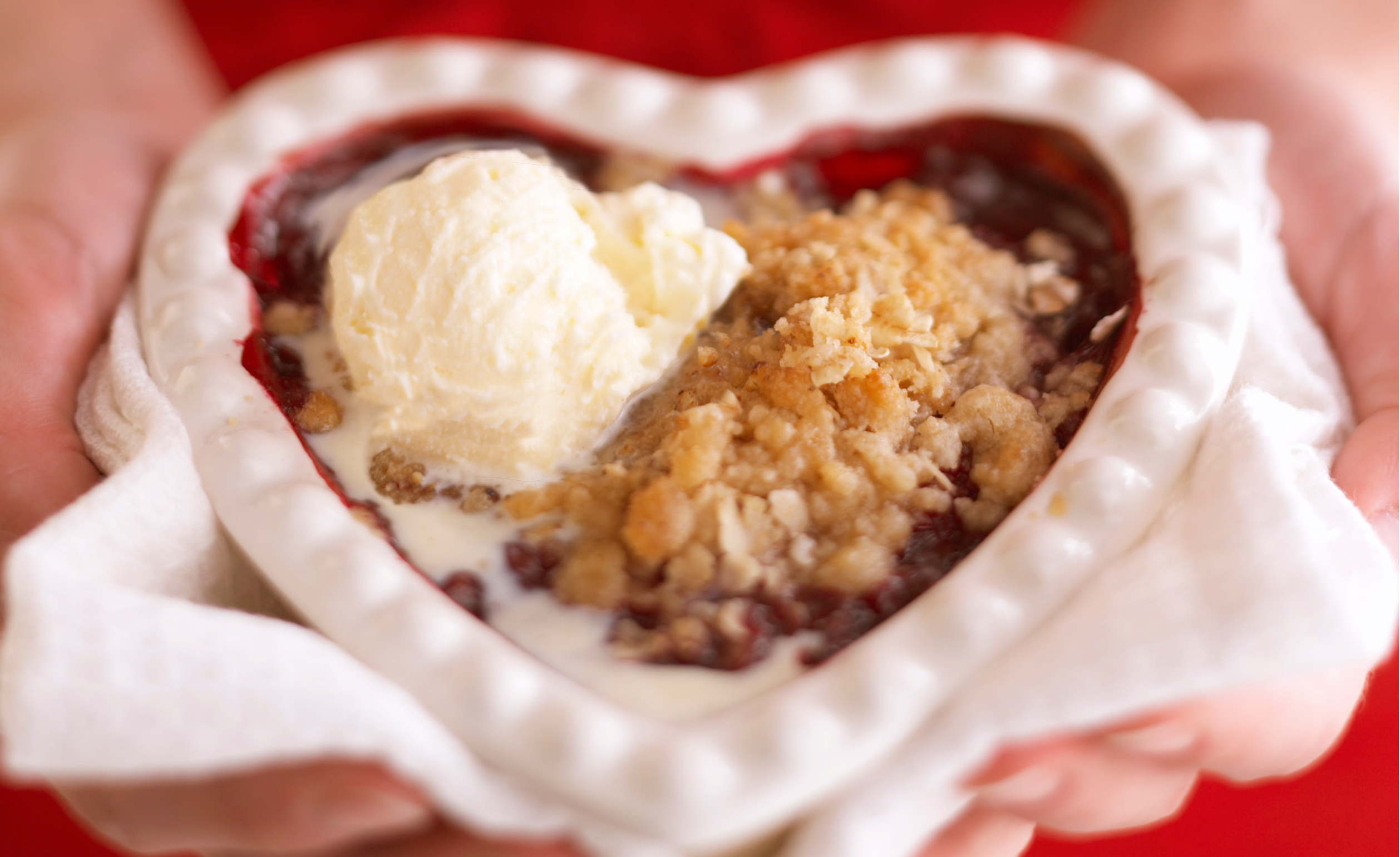 closeup of berry crisp and ice cream in heart shape dish alyssa wernick food stylist styling dallas tx