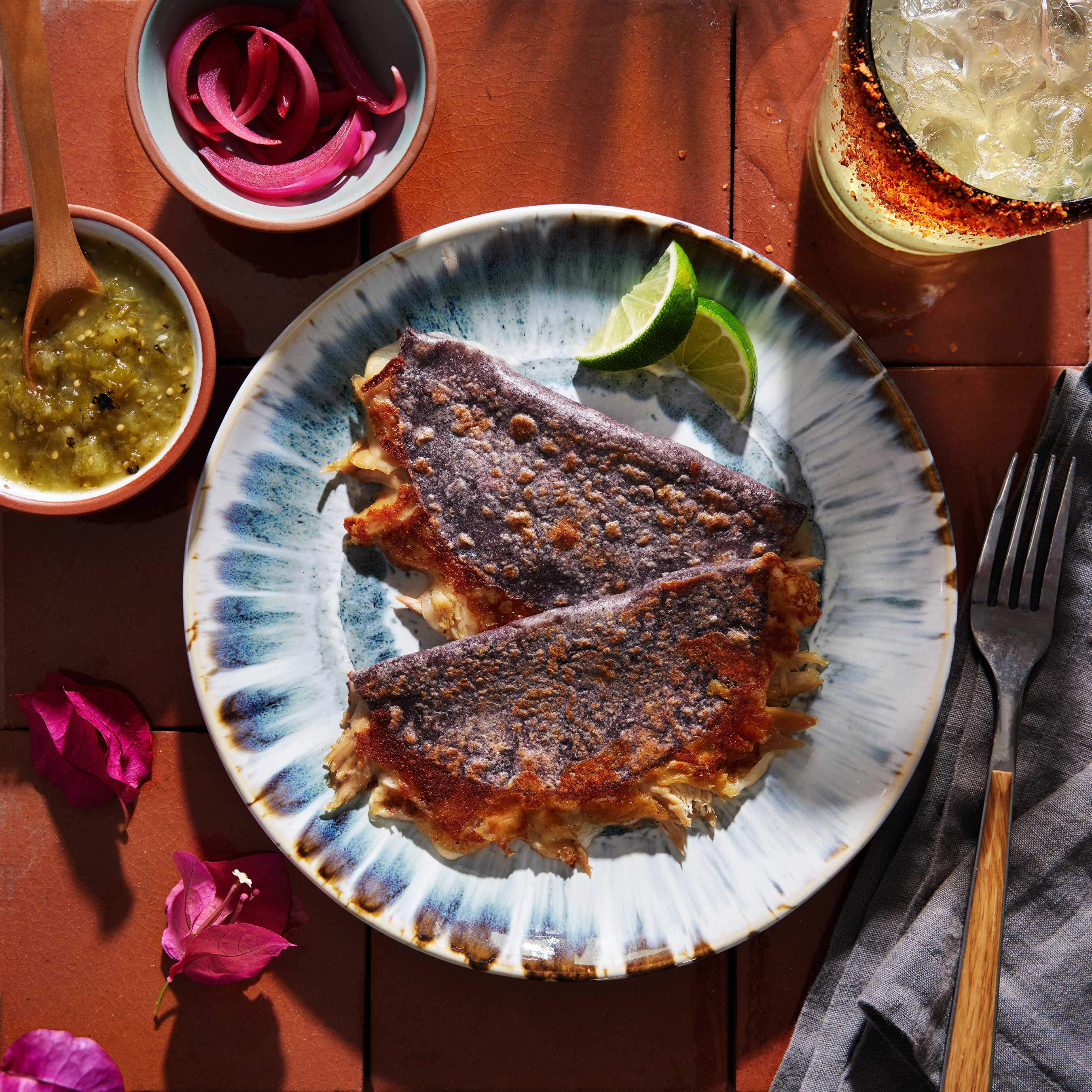 mexican chicken blue corn quesadilla with pickled red onion roasted green salsa and margarita on the rocks by alyssa wernick food stylist styling dallas tx 